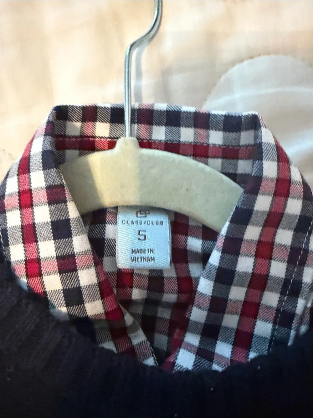 Two shirts, two sweater and a pair of cords